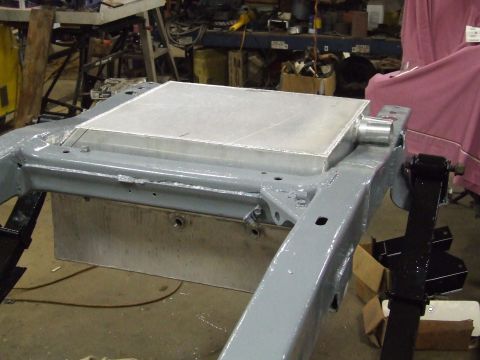 1967 Ford Bronco - A white car fender is shown with its mounting hardware and bolts.