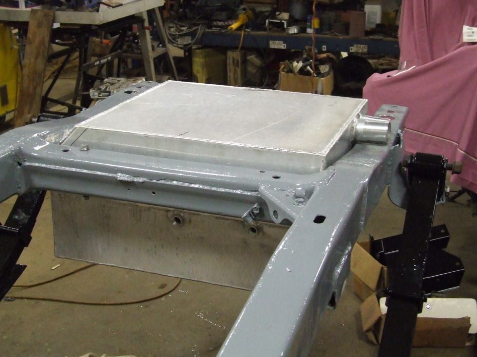 White car fender with visible bolts and mounting points