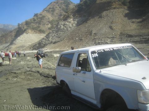 1990 Ford Bronco - Photo of a white Ford Bronco at a canyon off-road gathering, not a technical document.