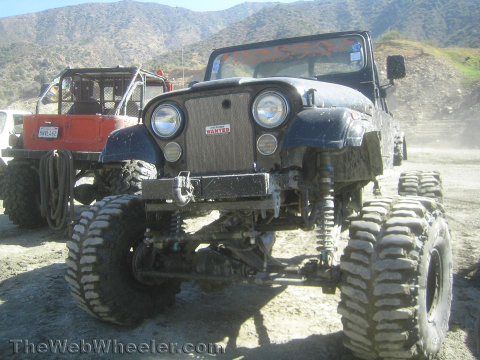Black Jeep CJ rock crawler with lifted suspension front view