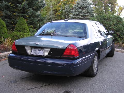 2001 Ford Crown Victoria - Rear view of a 2001 Ford Crown Victoria police car with a Massachusetts license plate.