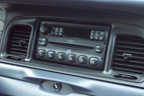 2001 Ford Crown Victoria - Interior view of a 2001 Ford Crown Victoria's dashboard, highlighting the center console with radio and climate controls.