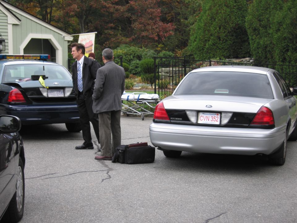 Rear view of a silver 2001 Ford Crown Victoria with license plate CVN 352