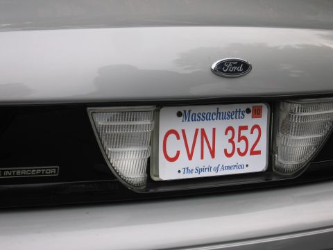 2001 Ford Crown Victoria - The rear of a silver 2001 Ford Crown Victoria displays its Massachusetts license plate.