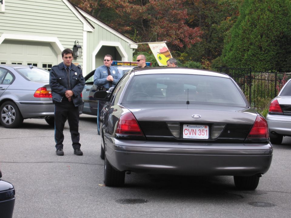 Rear view of a 2001 Ford Crown Victoria police car with license plate CVN 351
