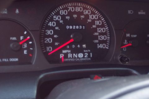 2001 Ford Crown Victoria - The dashboard gauges of a 2001 Ford Crown Victoria display 92,831 miles and the vehicle is in park.