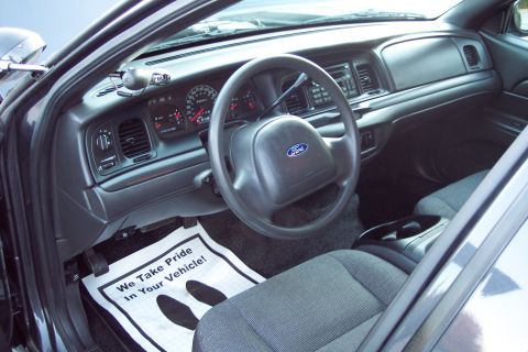 2001 Ford Crown Victoria - Interior of a 2001 Ford Crown Victoria, the dashboard and driver's seat.