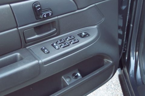 2001 Ford Crown Victoria - Interior view of the driver's side door panel on a 2001 Ford Crown Victoria.