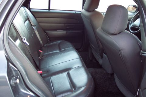 2001 Ford Crown Victoria - The rear interior of a car, including the back seats and a portion of the front seats, is visible.