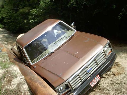 1985 Ford Bronco - slipped off the hillside. Slid down three feet into a large pipe. Talk about painful to ears; had to back up along the pipe *screetch*