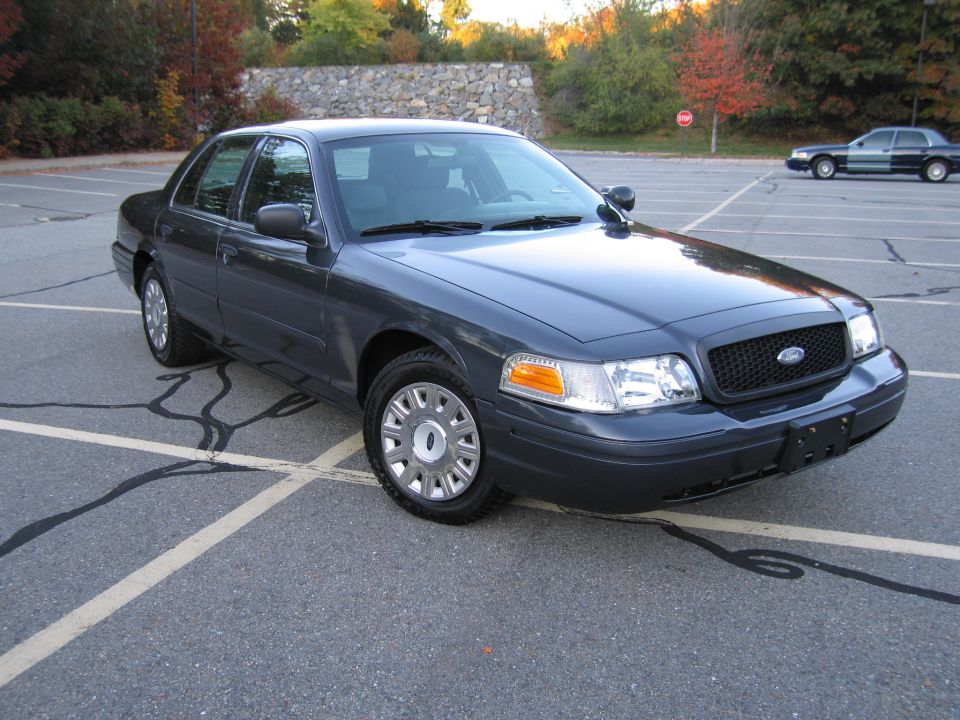Photo of a gray Ford Crown Victoria front three-quarter view in a lot