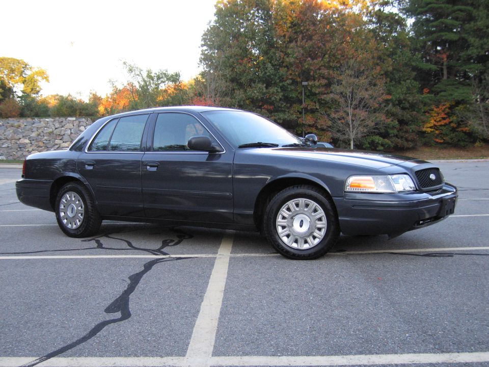 Ford Crown Victoria sedan, front three-quarter view in lot