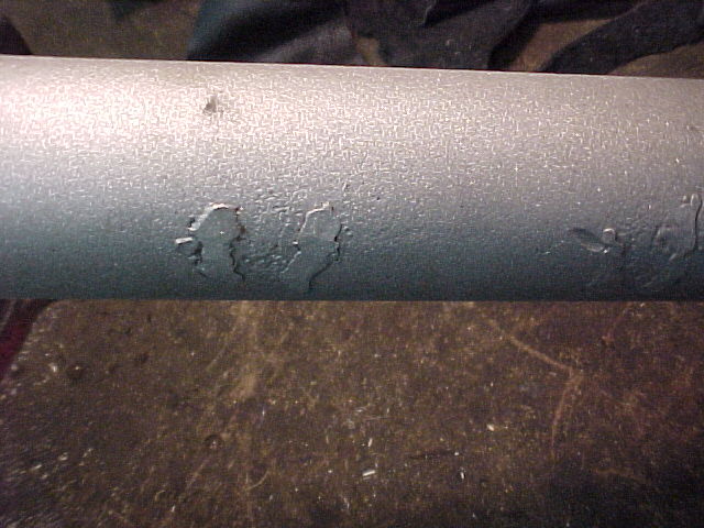 Damage to the rear axle from being used as part of a home made trailer. These old welds were ground smooth and don't show any more.