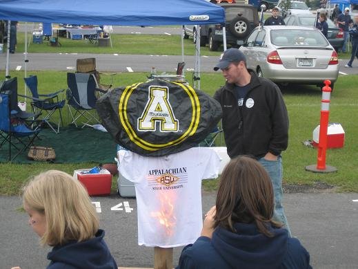 Man by Appalachian State University t-shirt display with flames and "A" logo