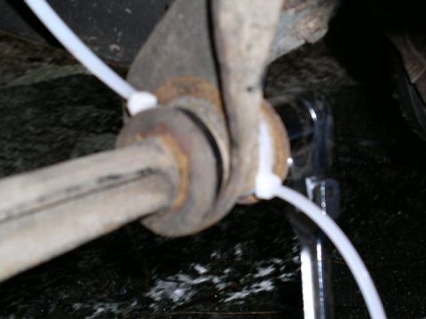 1979 Ford Bronco - A piece of nylon strap and a couple of zip ties. Works like a charm!