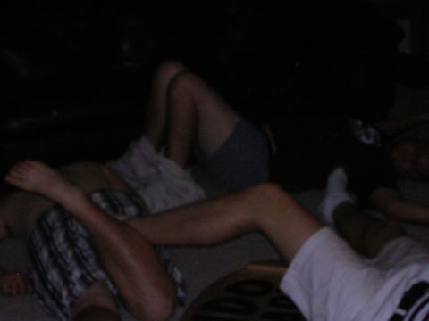 1983 Ford F-250 - People are resting on the floor in a dimly lit area. A watermark for Supermotors.net is visible.