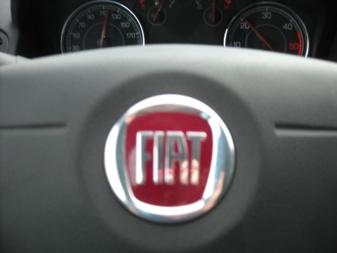1979 Ford F-150 - Close-up of a Fiat steering wheel and dashboard gauges.