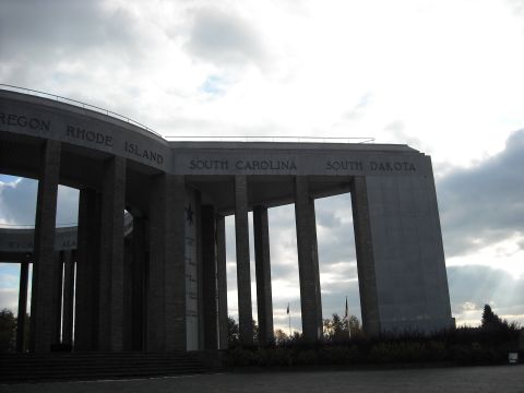 1979 Ford F-150 - A monument with inscribed state names under a cloudy sky.