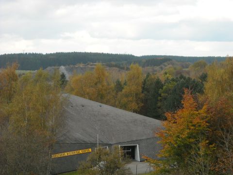 1979 Ford F-150 - The Bastogne Historical Center is seen with colorful autumn trees and a quarry in the background.