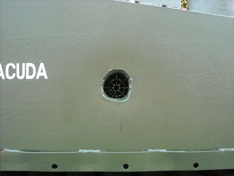 Green panel with white text 'ACUDA' and a circular vent
