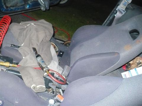 1993 Ford Probe - Interior view of a car with tools laid out on the seats and center console.