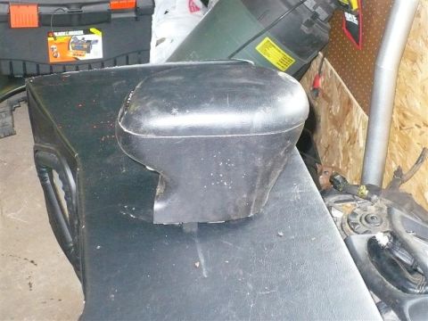 1993 Ford Probe - A detached black car door mirror is shown, with other items in the background.