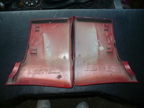 1993 Ford Probe - Two red plastic trim pieces are shown, likely for a car's interior or exterior.