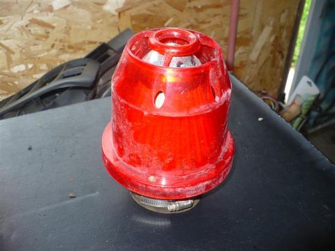 1993 Ford Probe - Aftermarket red air intake filter assembly with a metal clamp attached.
