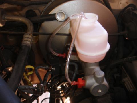 1992 Ford F-350 - Master cylinder and brake fluid reservoir assembly, likely from a vehicle's braking system.