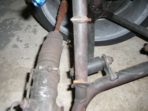 1988 Ford Bronco - Close-up view of vehicle steering and suspension components, showing rust and wear.