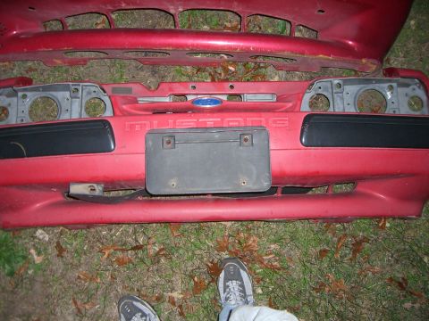 1988 Ford Bronco - Rear bumper assembly and taillight housings from a Ford Mustang, likely from the late 1980s.