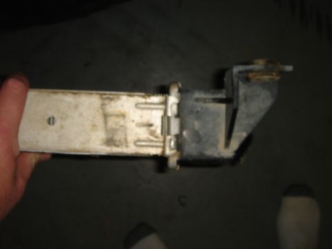 1996 Ford Bronco - Close-up of a radiator component held by a hand.