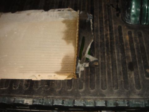 1996 Ford Bronco - A damaged radiator is shown, indicating a blown radiator issue.