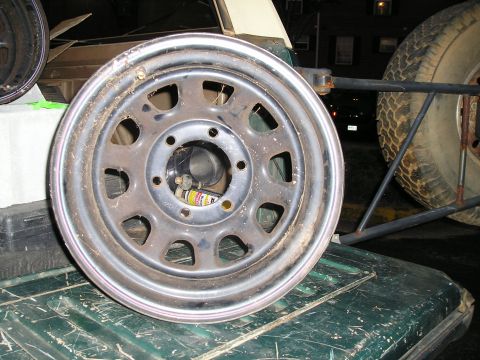 1989 Ford Bronco - A steel wheel and off-road tire are shown, likely for a truck or SUV.