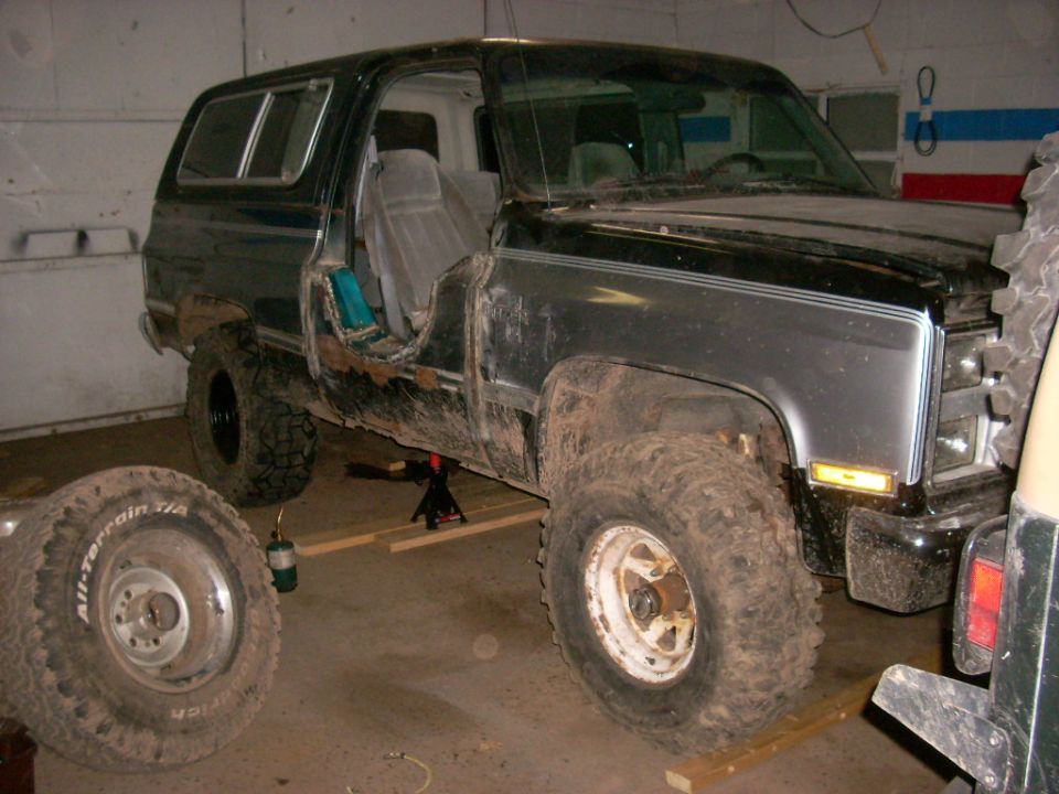 Black 1988 Chevrolet Blazer with driver's door removed, seen from 3/4 front
