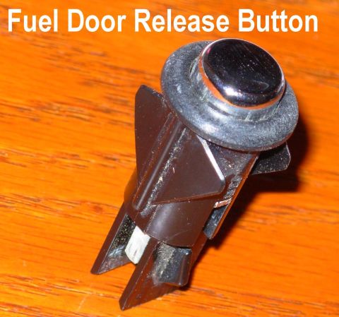 1994 Ford Crown Victoria - Fuel Door Release Button from Crown Vic/Grand Marquis The flash & zoom bring out the details, but the bezel is actually just as black as th…