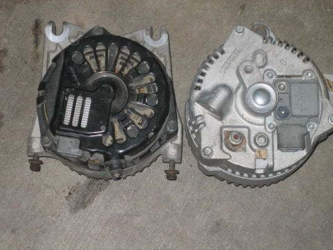 1996 Ford Thunderbird - Two automotive alternators are shown side-by-side, likely for comparison or sale.