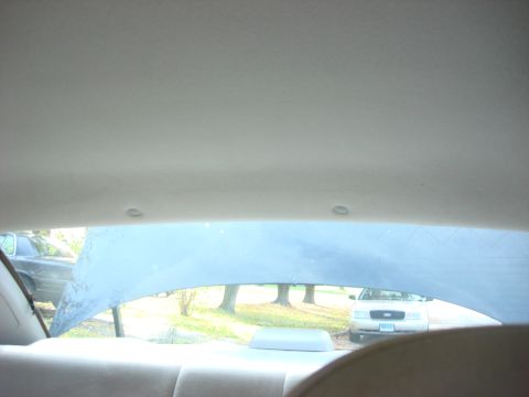 2003 Ford Crown Victoria - View from the back seat of a 2003 Ford Crown Victoria, looking out the rear window at another Crown Victoria.