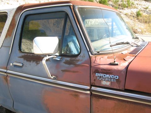 1979 Ford Bronco - Close-up of a 1979 Ford Bronco Ranger, showing the fender badge and side profile.