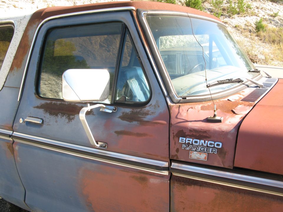 1979 Ford Bronco Ranger fender badge and side view of driver's door and window