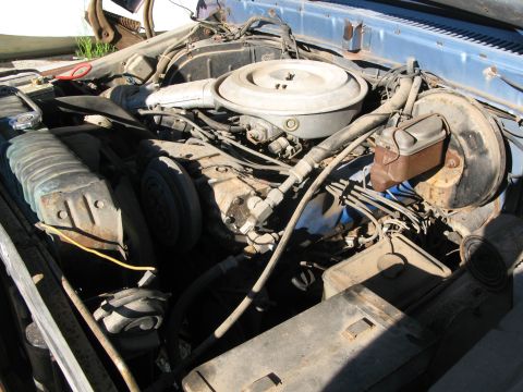 1979 Ford Bronco - Close-up view of a vehicle's engine bay, showing various components and wiring.