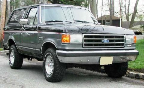 1989 Ford Bronco - This 1989 Ford Bronco is shown from a three-quarter front view, parked outdoors.