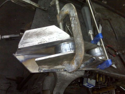 1980 Ford Bronco - Custom lift kit component being welded in a workshop.