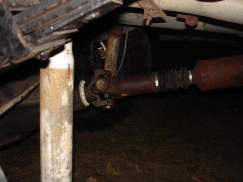 1996 Ford F-150 - Close-up of the driveshaft and suspension components on a vehicle's undercarriage.