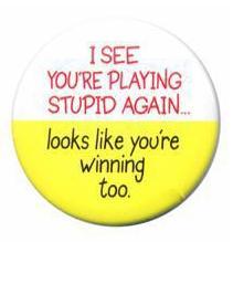 2000 Ford Crown Victoria - This button features a humorous message about playing stupid and a logo for SUPERMOTORS.