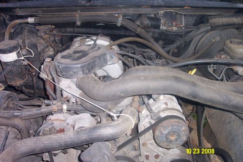 1992 Ford Bronco - Close-up view of an engine bay, showing various mechanical parts and hoses.