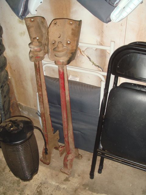 1992 Ford Bronco - Pair of old suspension components, likely for a truck or SUV, stored indoors.