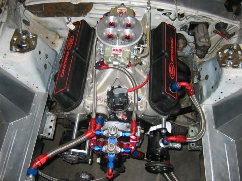 1992 Ford Mustang - Customized Ford V8 engine Ford Racing valve covers and a performance carburetor.