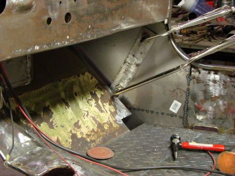 1948 Jeep Wrangler - Interior of a vehicle being repaired, with visible rust and fresh welds.