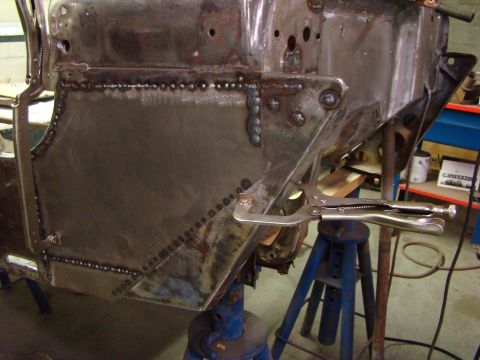 1948 Jeep Wrangler - Metal body panel repair in progress, secured with vise grips.
